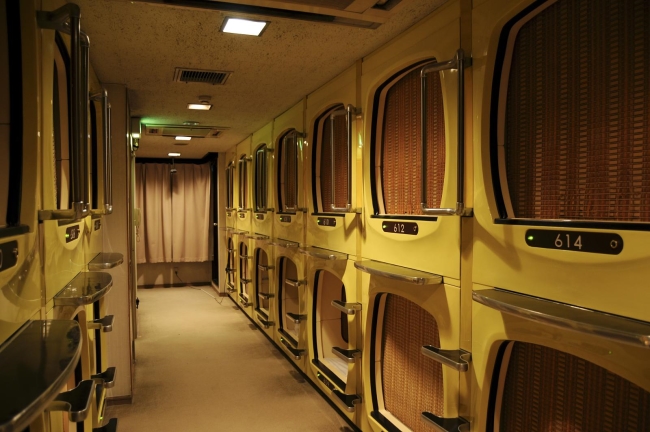 Capsule hotel hallway Many capsule hotel rooms