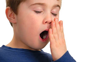 child sleep apnea - boy yawning