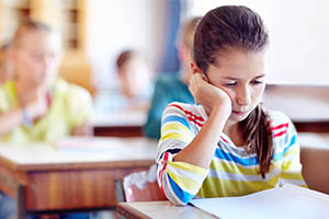 child insomnia - girl tired at school