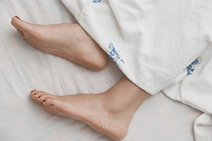 sleep leg cramps - feet in bed
