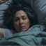 Woman awake in bed with insomnia