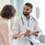 Doctor talking to patient in office