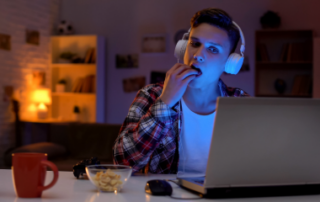 Teen awake at night gaming and snacking